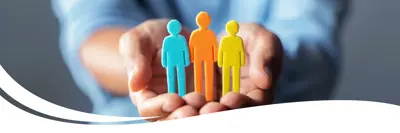 Image of two hands holding colourful paper people.