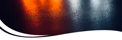 Image of emergency services lights reflecting on wet pavement.