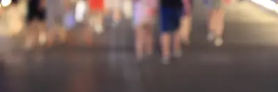 Group of people walking on the road in the same direction