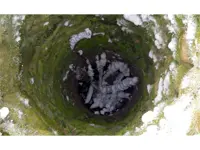 Looking down into an abandoned well