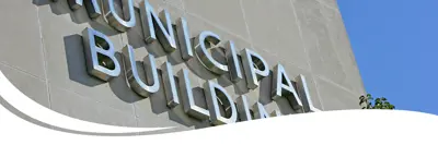 Image of a sign on a building that says municipal building.