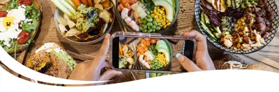 Image of a table full of a variety of healthy dishes of food.